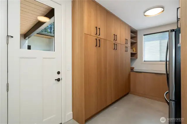 And here is the Pantry room with all the cabinets. Door leads to exterior patio on the south side of The Pointe at Lake Sawyer