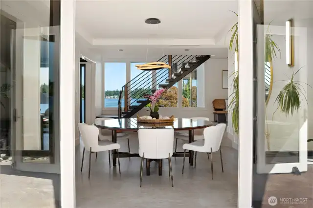 Dining room from one of the many exterior patios. Imagine breaking bread with this incredible view!