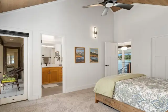 This is one of the upstairs bedrooms that has vaulted ceilings, it’s own 3/4 bath, and shares a deck for morning coffee if you like, of course all while enjoying the Pointe at Lake Sawyer views.