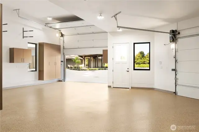 Another view of the inside detached shop, featuring the 12 foot high garage door to accommodate your Boat/RV.