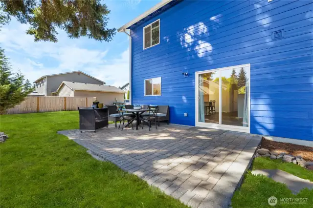 Patio off kitchen with large yard