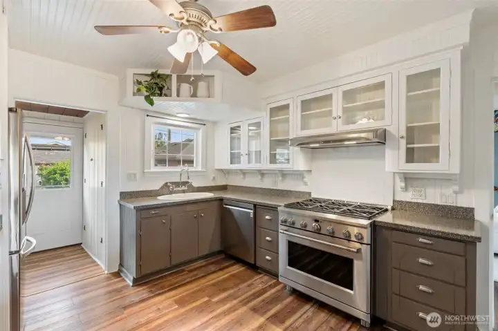 Kitchen with gas range, modern updates, and ample storage.