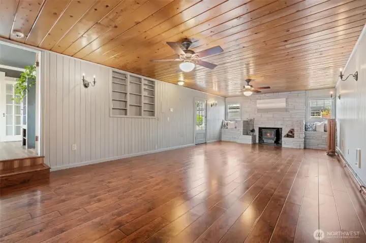 Family room with fireplace and direct access to the backyard.