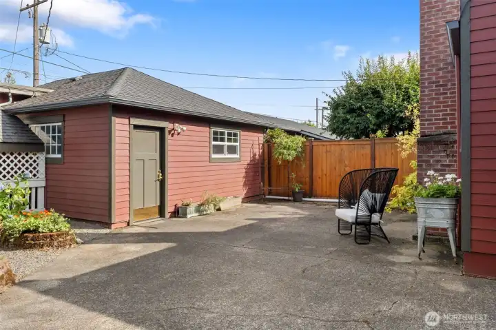 Detached outbuilding includes a small shop for hobbies or storage.