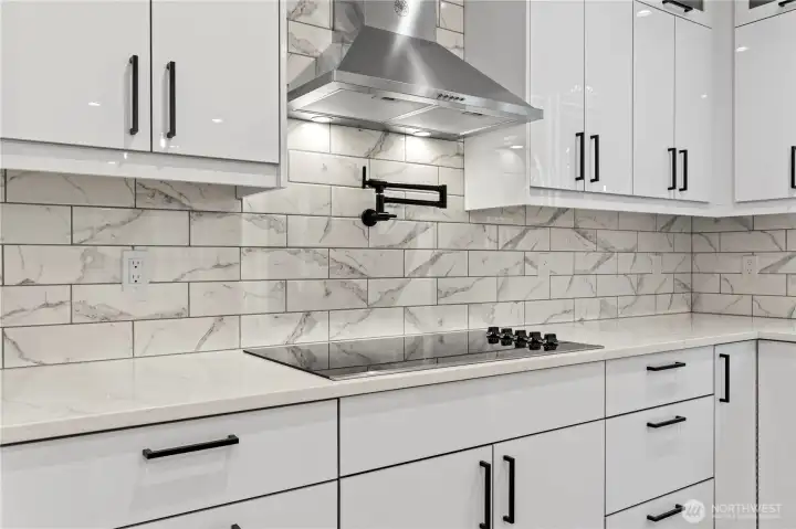 Induction cooktop and pot filler