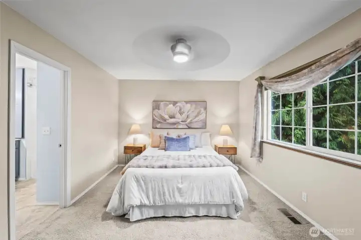 Your primary suite features a walk-in closet and beautifully updated en suite bath