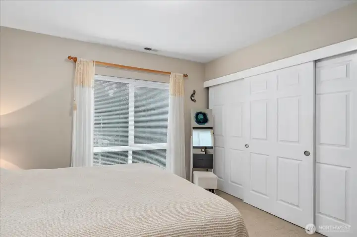 Wall-to-wall closets and large picture window for natural light.