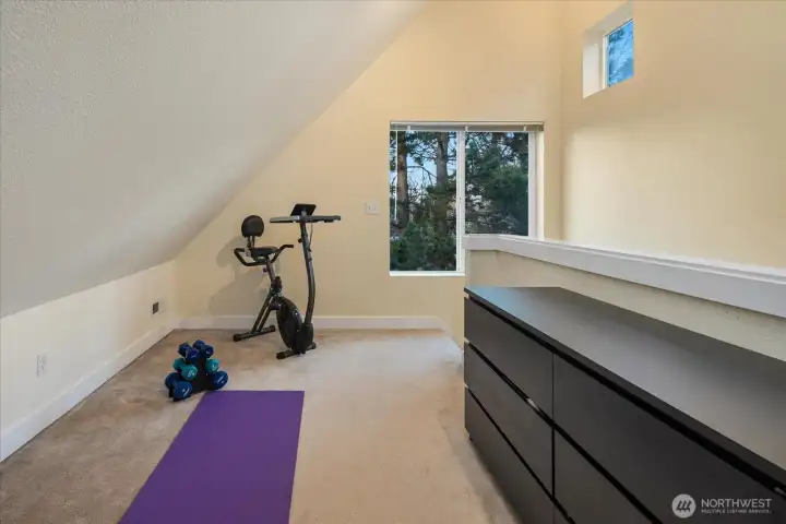 Wellness corner with window, perfect for yoga or stretching.