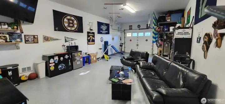 Huge garage with epoxy floors and tons of storage