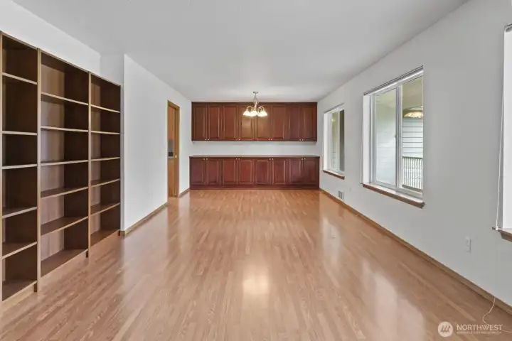 Great room as you enter the home Built in custom bookshelf.