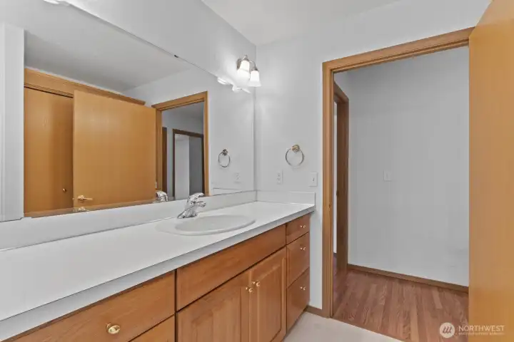 Hall bathroom offers a deep tub/shower combo and plenty of counter space.