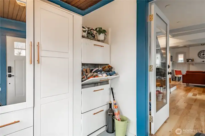 Hot water tank secure behind shoe cubby