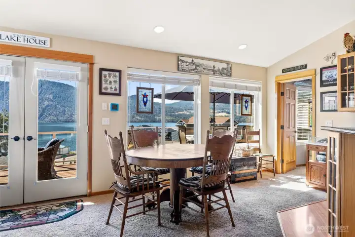 Dining area and entrance to primary 1 Bedroom suite, kitchen to right
