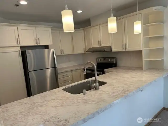 Spacious updated kitchen with breakfast bar