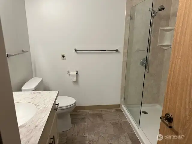 large walk in closet with safety bar