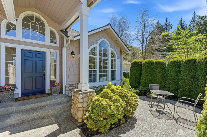 Charming front patio—an ideal setting for morning coffee or unwinding in the afternoon