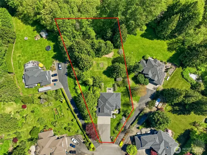 Aerial perspective showcases the expansive property with approximate lot lines for reference