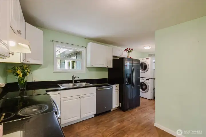 Another view of the kitchen. Look out to your backyard while washing the dishes Another view of the kitchen. Look out to your backyard while washing the dishes