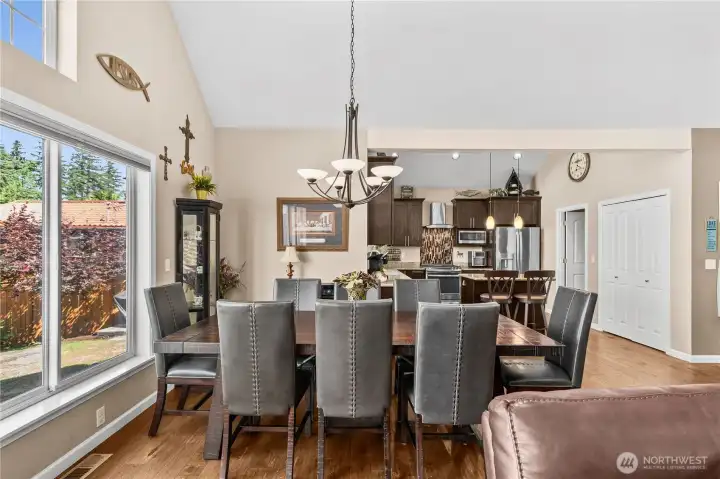 Dining room with vaulted ceilings and sweeping views of Lake Tapps.