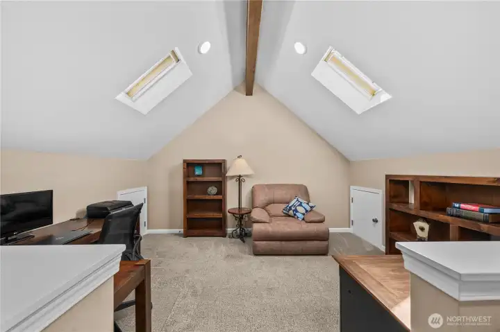 Loft with Vaulted ceilings and skylights