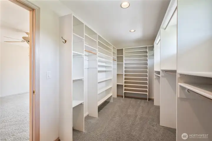 Primary bedroom walk in closet