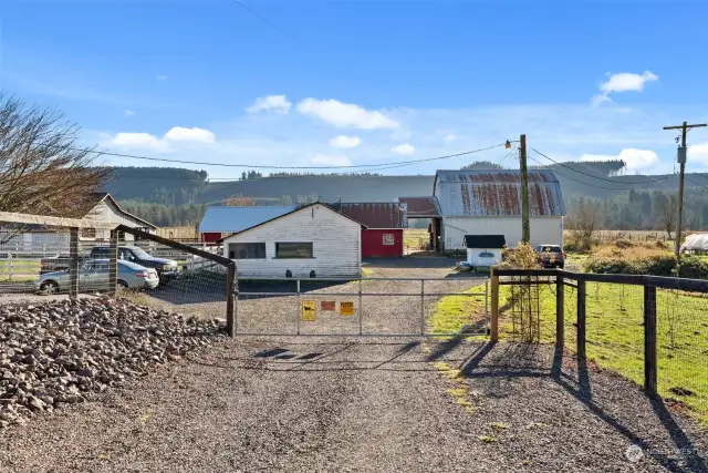 This property is thoughtfully designed for functionality and convenience, featuring three spacious barns and a former milk house, all interconnected by well-planned holding pens and alleyways. Ideal for livestock management, the layout ensures ease of movement and efficient operations. Additionally, the outdoor arena area provides ample space for training, riding, or other agricultural activities, making this property a versatile choice for those seeking a move in ready farm