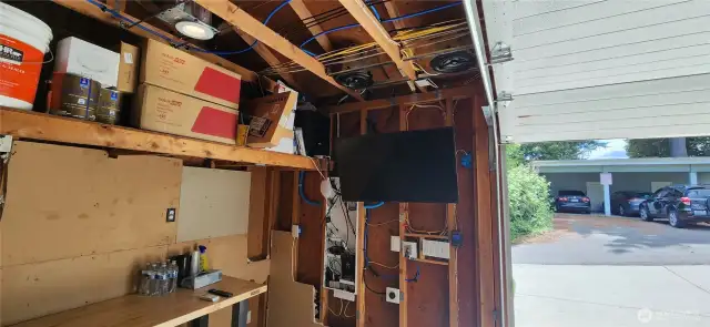 TV, sub woofers and speakers installed, large work bench too