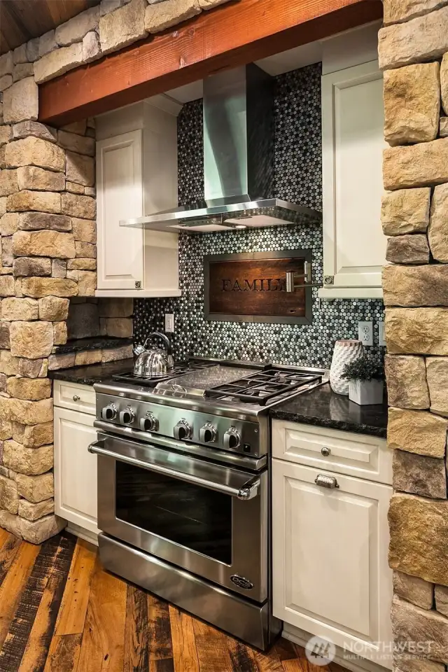 6 burner Fisher Paykal range with double ovens.