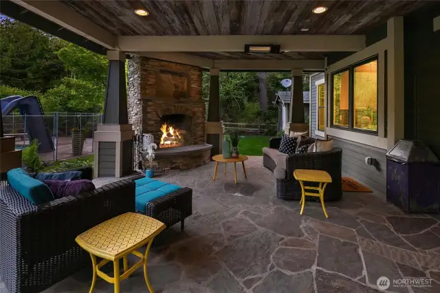 Nanadoors open to this 590 sf 3 season space covered patio that has ceiling mounted heaters and a reclaimed barnwood ceiling..