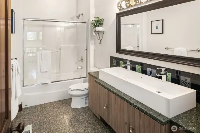 Full bathroom upstairs with dual sinks.