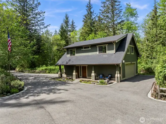 1200 sf DADU with 1080 sf MIL upstairs.  The covered porch has a private entrance to the MIL, a separate man door to the shop space and a utility sink.  Note the second set of double garage doors for drive through convenience.  Perfect for the hobbyist, artist or car enthusiast.