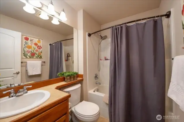 Full bath next to second bedroom.