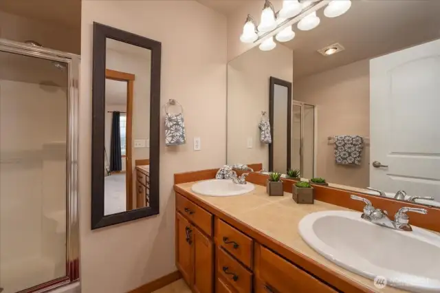Double sink and roomy shower make this suite a home run!