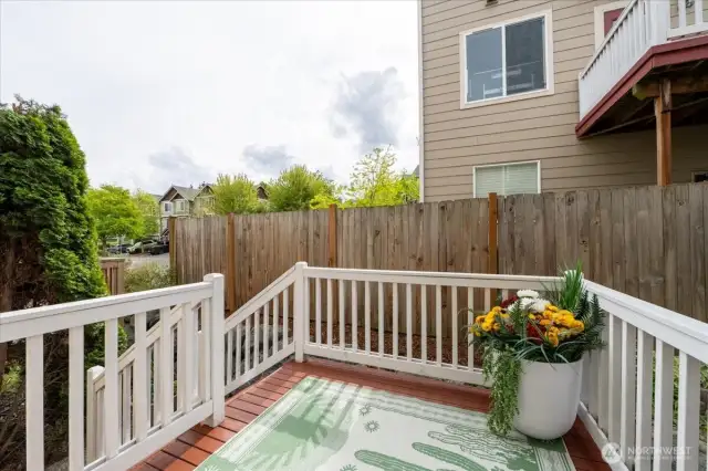 Room for an outdoor table and BBQ.  You could also grow a vertical garden.