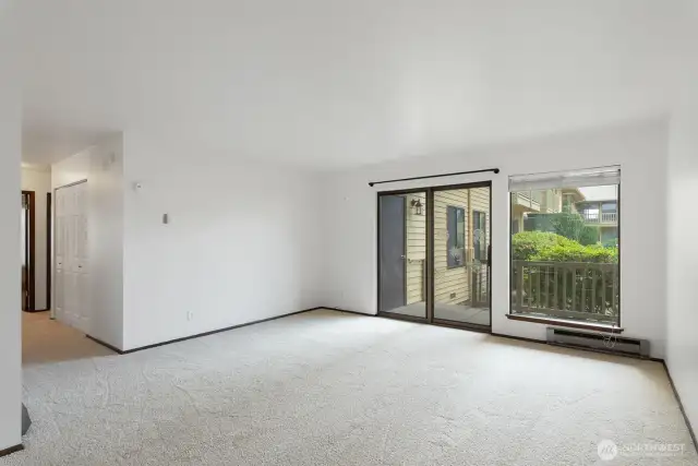 Living room with slider out to patio and courtyard