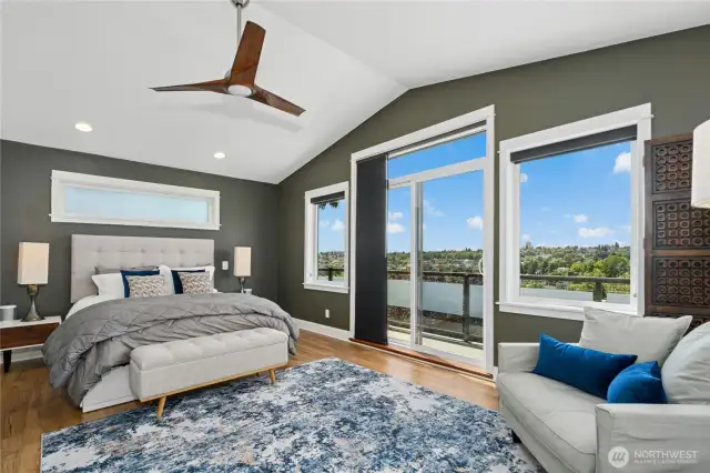 Vaulted ceilings and a private walk-out balcony with a freshly painted deck