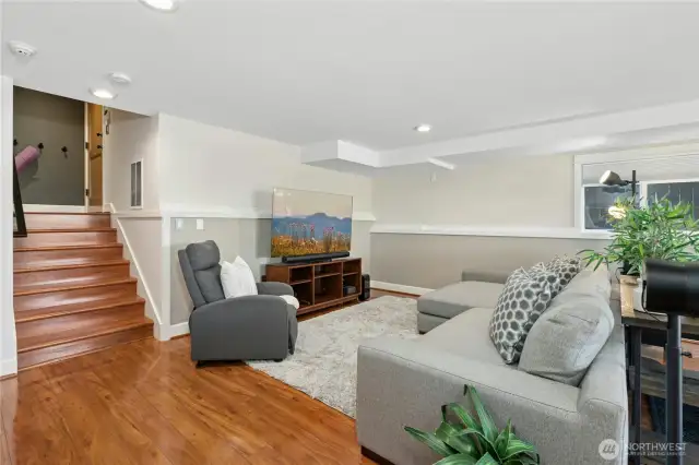 Engineered wood floors, custom blinds, dual-mode lighting, and patio access