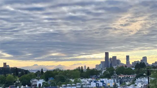 Enjoy the ever-changing sunset city and mountain skyline