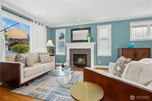 Gas fireplace with custom wood mantel anchors the cozy living space