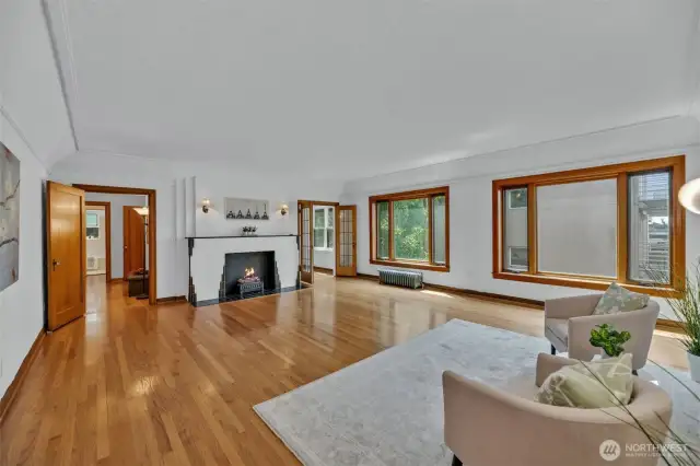 New wood windows offer natural light reflecting off the gleaming hardwood floors. Peekaboo water views too.