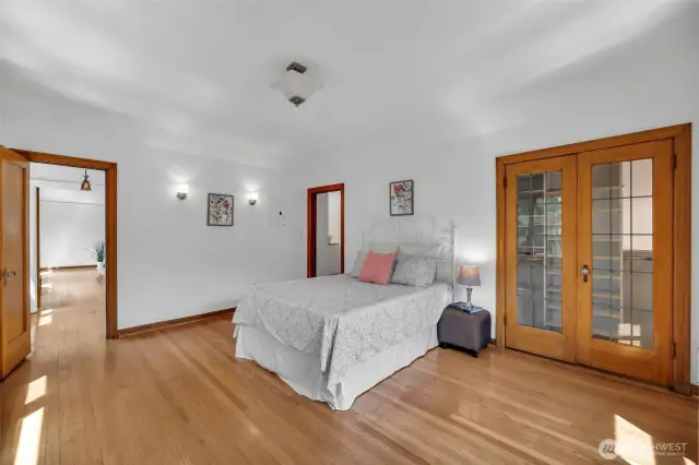 Huge primary bedroom with historical touches.