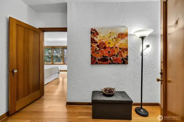 From the bedroom into the main entry, bath is on the left.