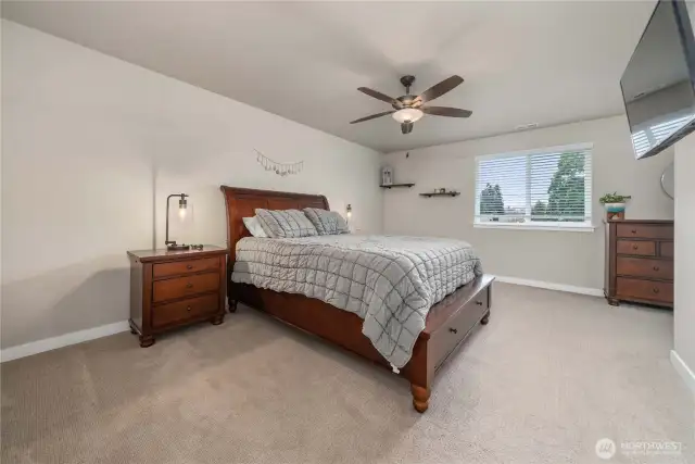 Upstairs you'll find the primary bedroom at the top of the stairs