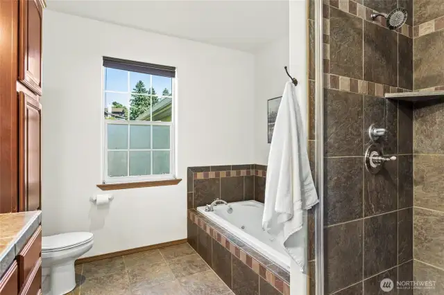 Custom tile work in the separate bath and shower