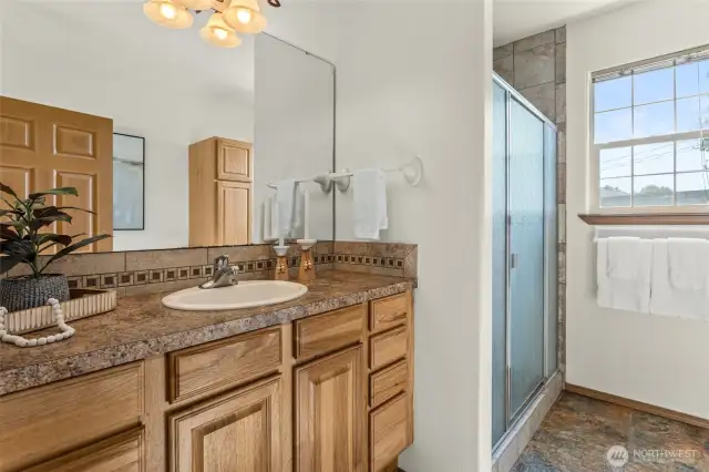 Another full bath is shared with bedroom two and three
