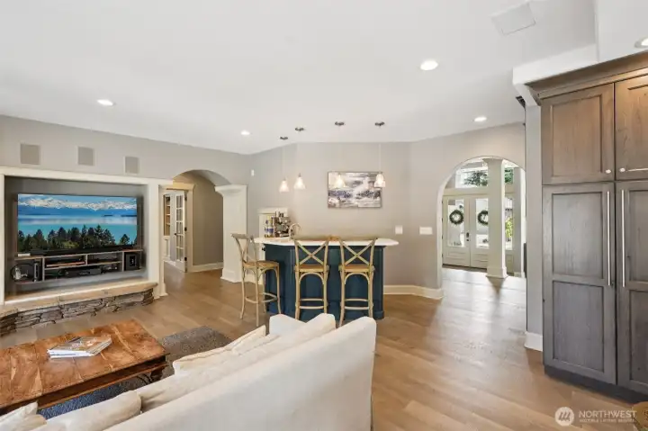 Statement fireplace and oversized windows invite comfort and connection”
