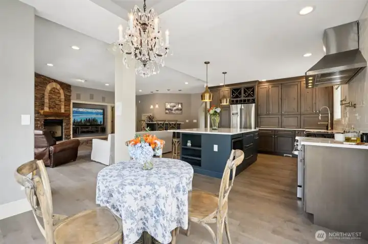 Fully remodeled kitchen with Wolf range, quartz countertops, and RH lighting