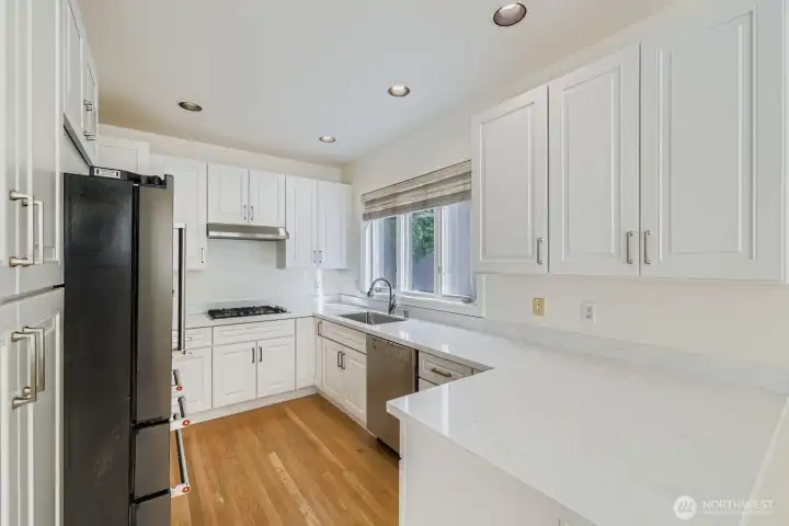 Fully remodeled kitchen with new cabinets and quartz countertops