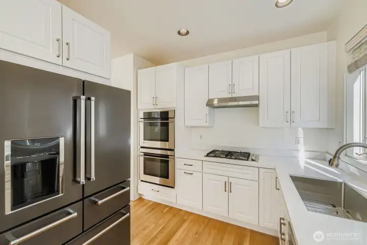 Fully remodeled kitchen with new cabinets and quartz countertops and stainless steel appliances