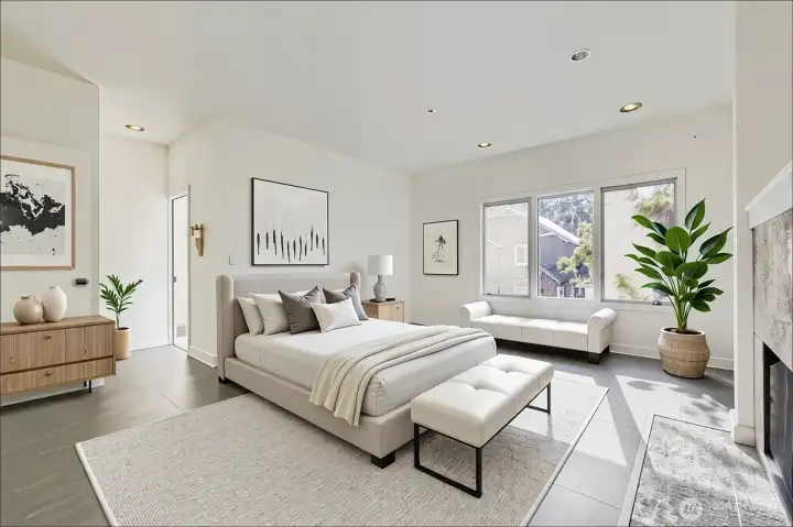 Primary bedroom suit has a fireplace and is large enough for additional furniture.